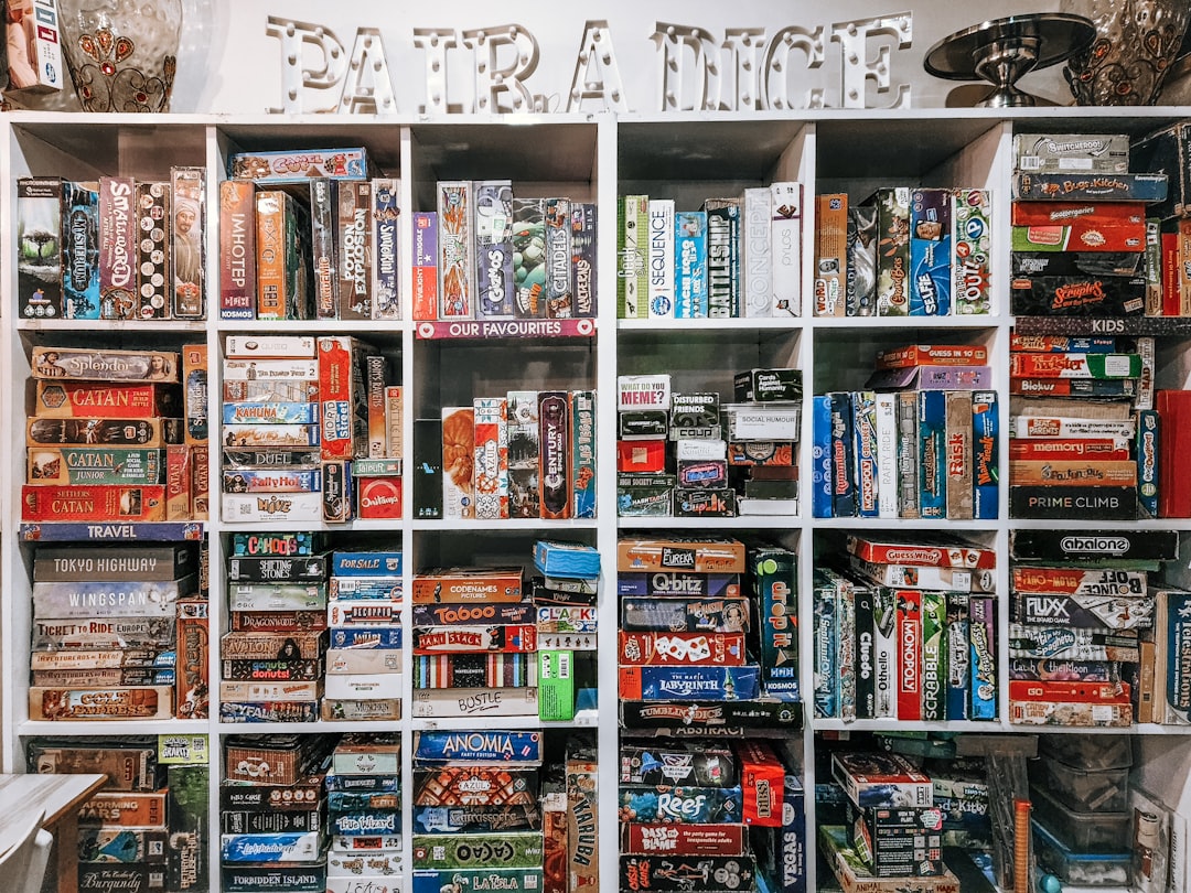 Shelves filled with numerous board games and puzzles.